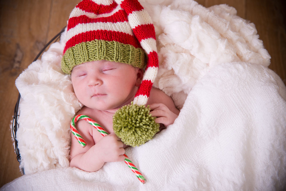 Baby photographed on a plain studio backdrop at the Beeston studio